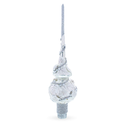 a white and silver christmas tree topper