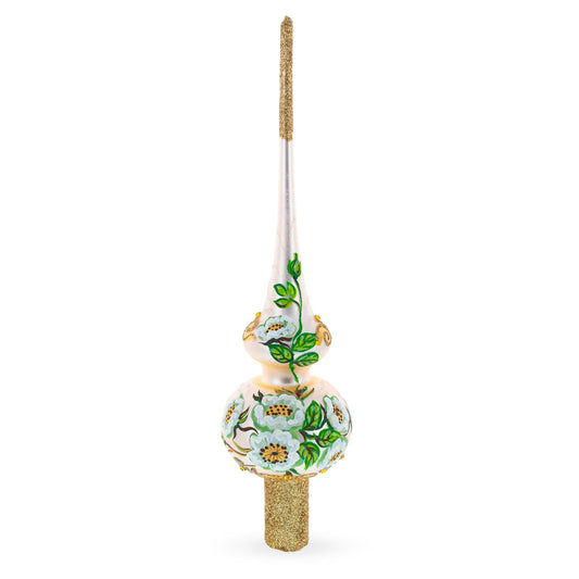 a white and gold decorated christmas tree topper