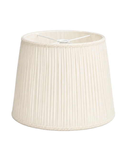 a white lamp shade with a white shade