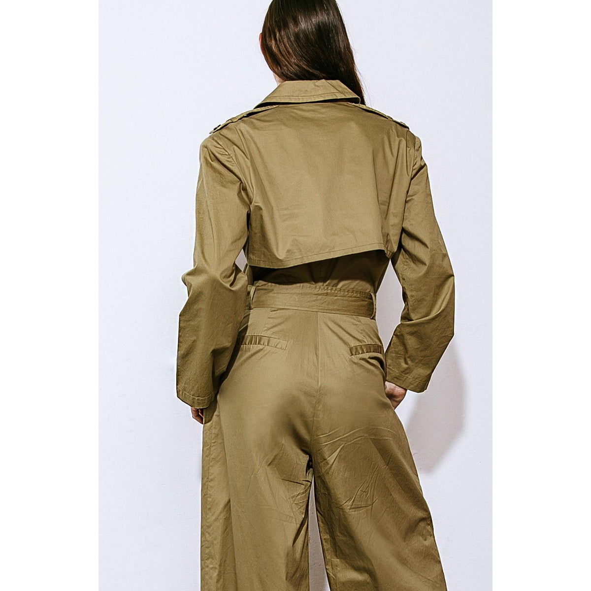 a woman in a green jumpsuit