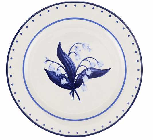 a plate with a flower painted on it