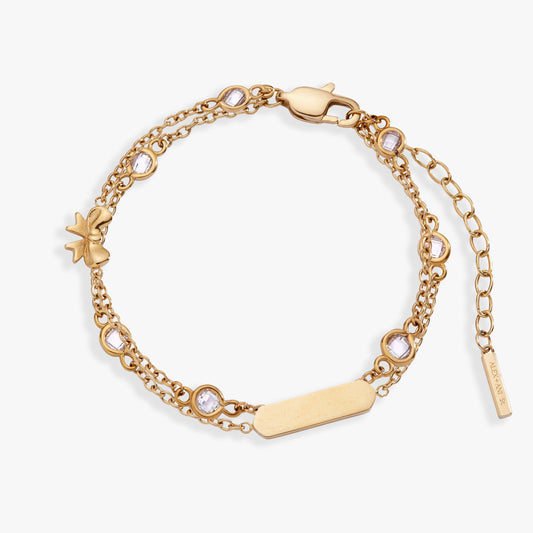 a gold bracelet with diamonds and a tag