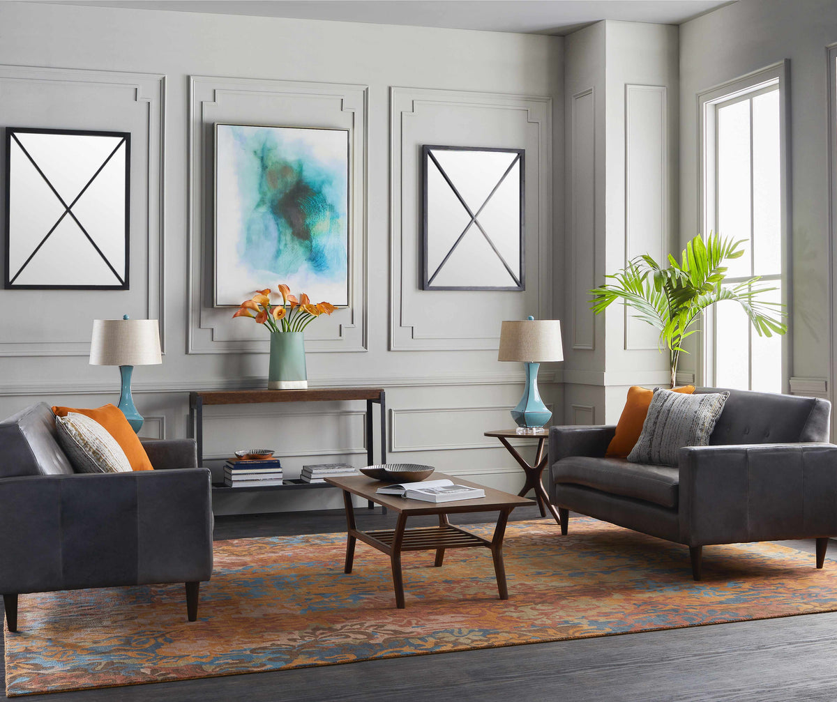 a living room with a couch and chairs