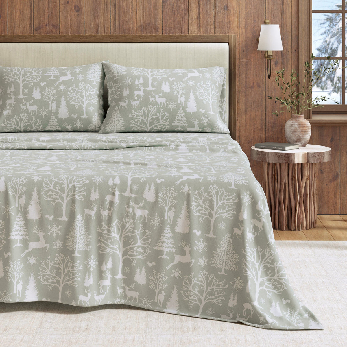 a bed with a blanket and pillows