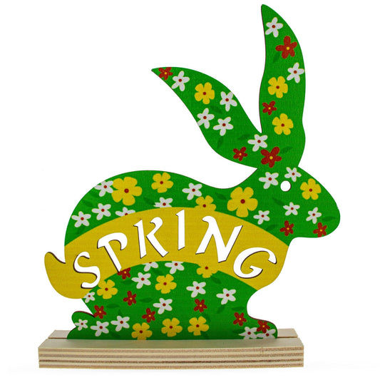 a green bunny with flowers on it