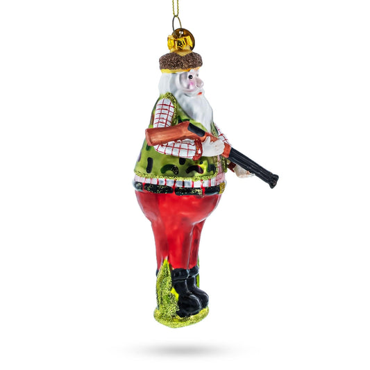 a christmas ornament with a santa holding a gun