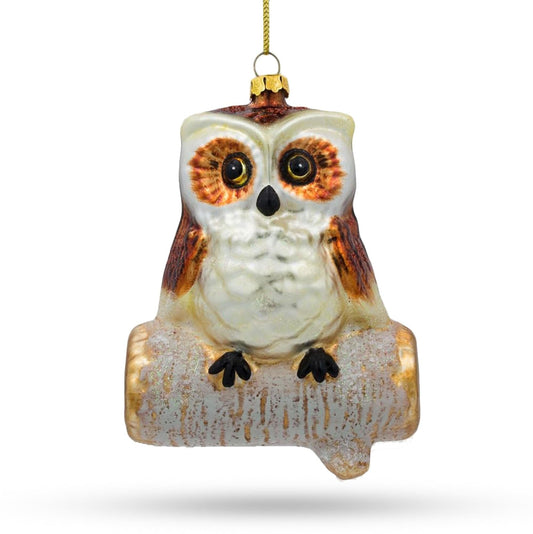 an owl ornament on a white background