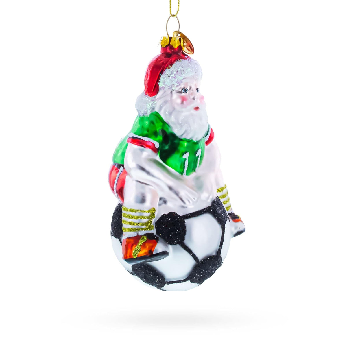 a christmas ornament with a football player on the ball
