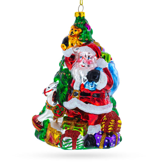 a christmas tree ornament with santa claus and presents