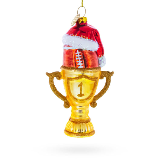a gold trophy with a red hat on it