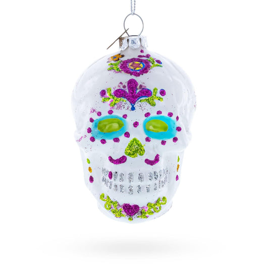 a white skull ornament with colorful glitter