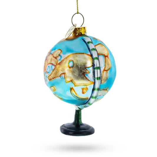 a blue globe ornament with gold and white designs