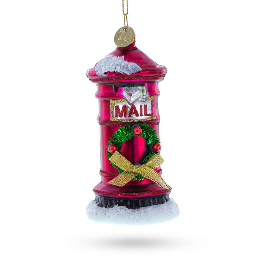 a red christmas ornament with a gold coin