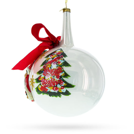 a white christmas ornament with a red bow