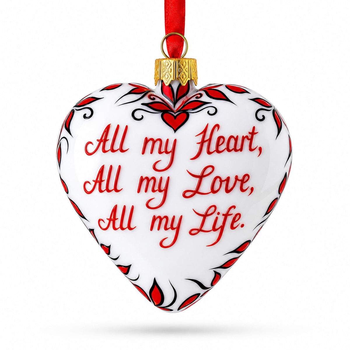 a heart shaped ornament with red and white text