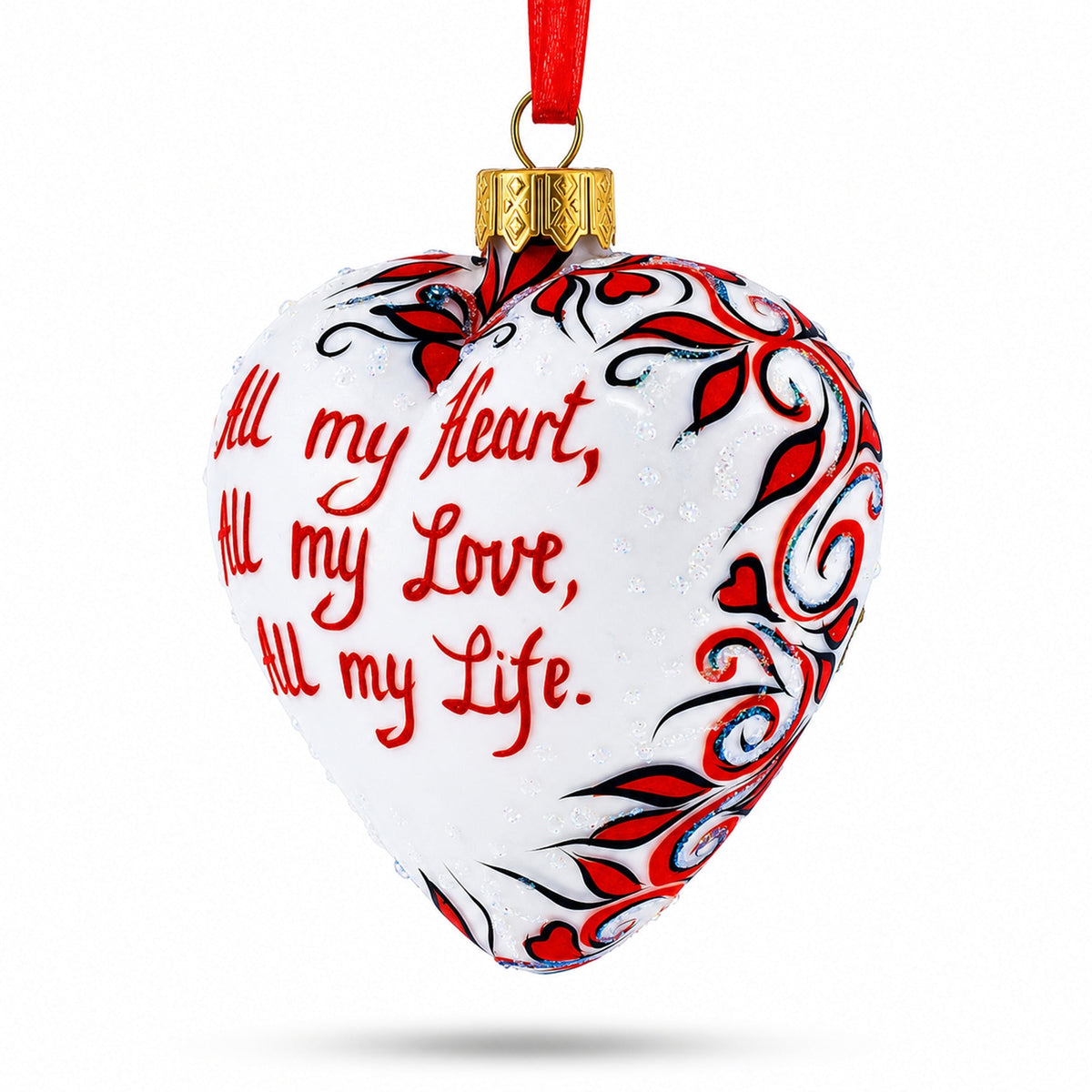 a heart shaped ornament with red and white text