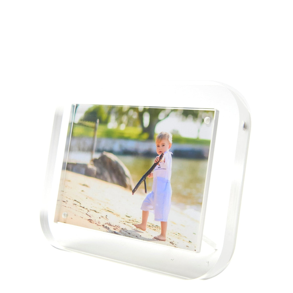 a picture frame with a boy playing a flute