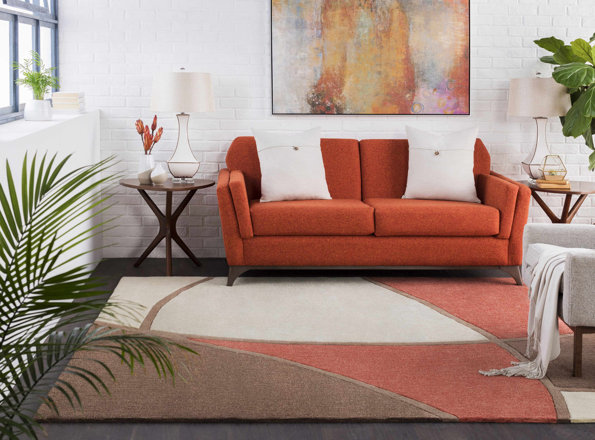 a living room with a couch and a rug