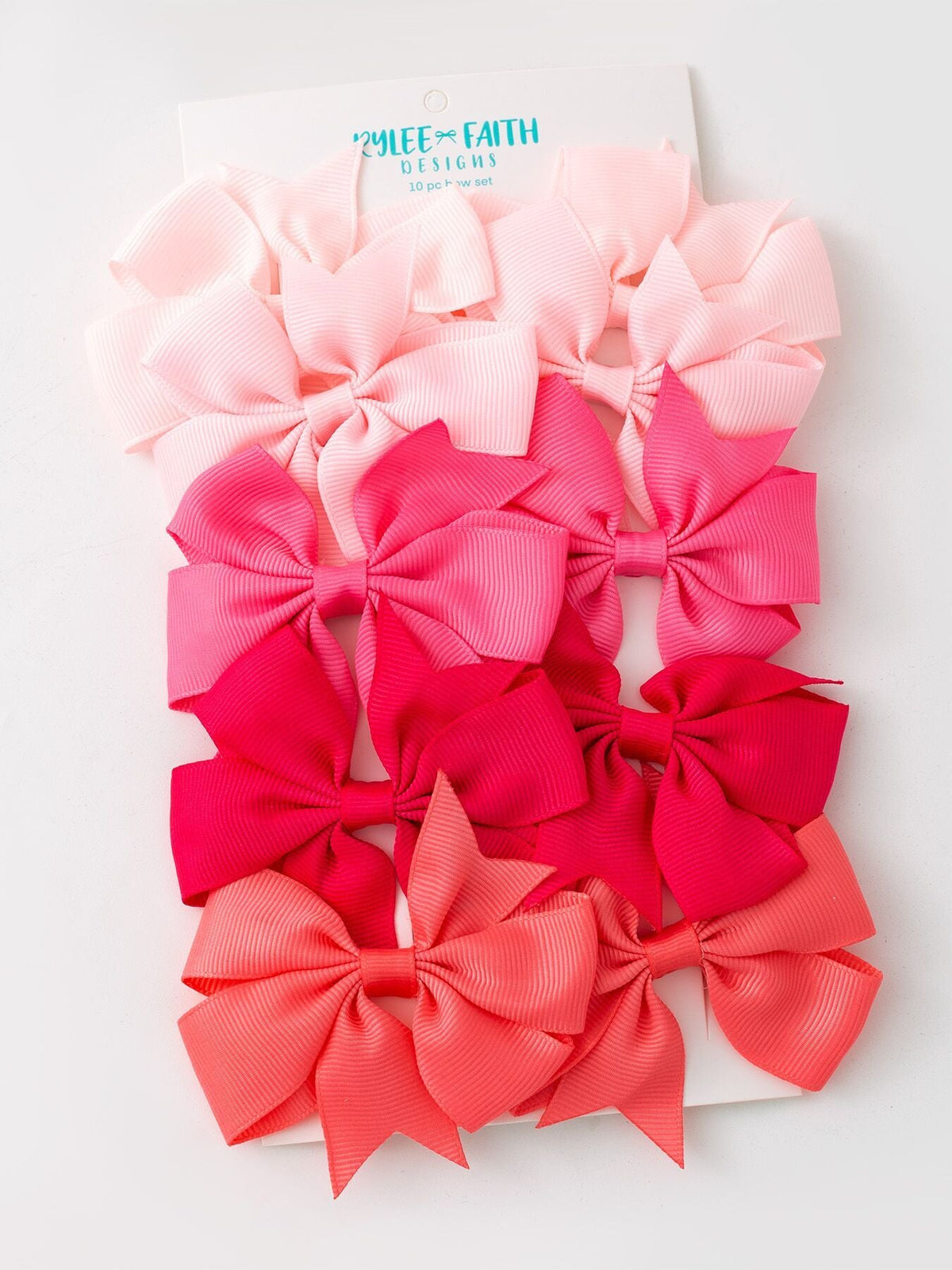a group of pink and red bows