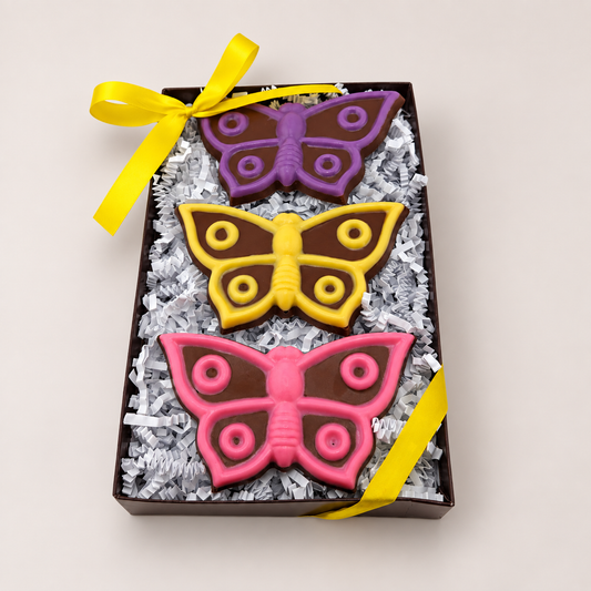 a box of cookies with butterflies