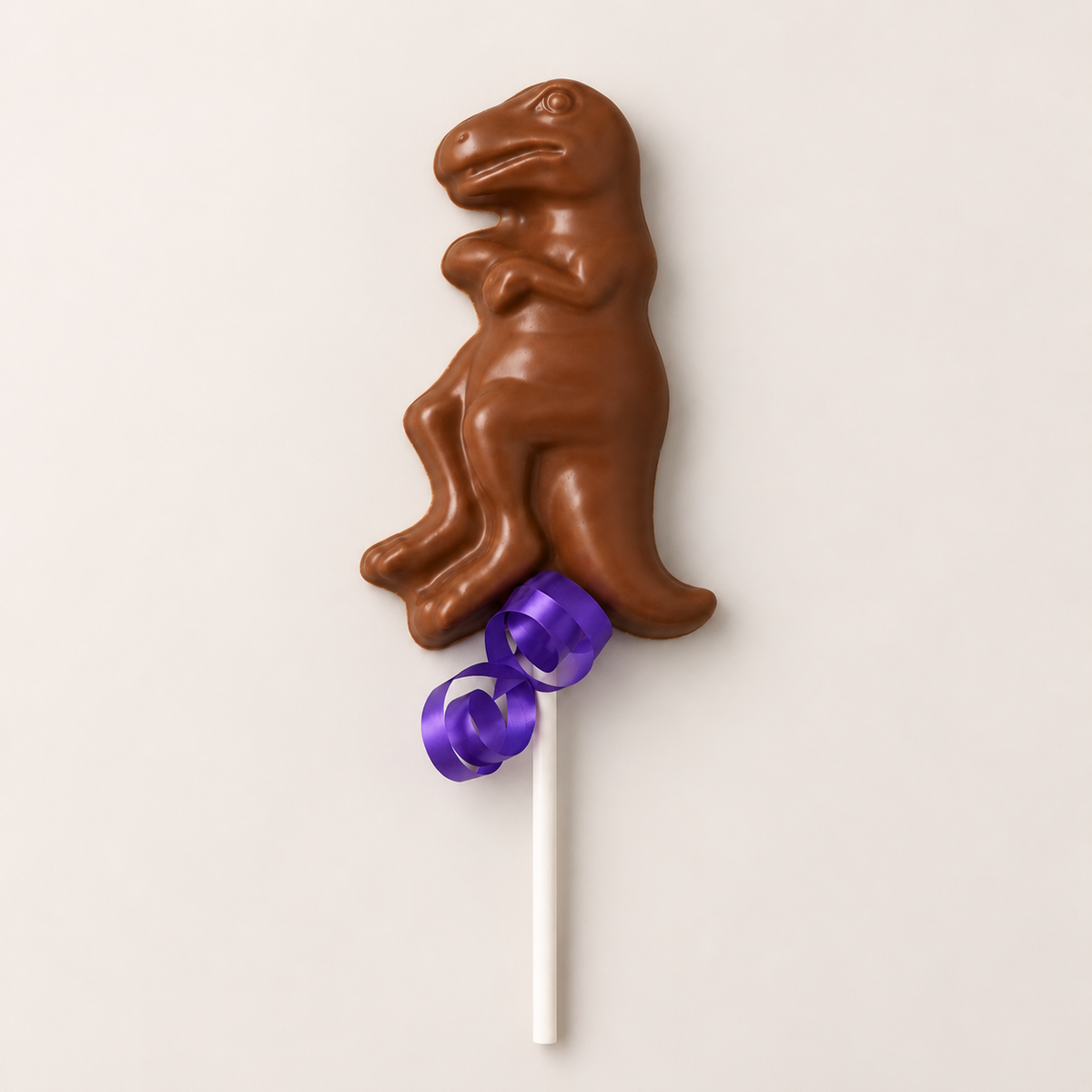 a chocolate dinosaur on a stick