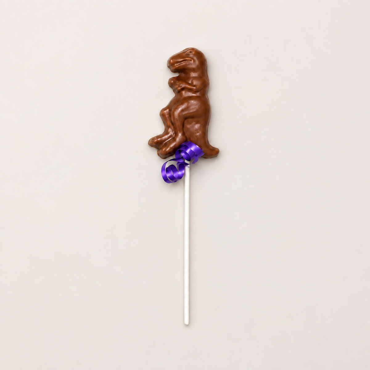a chocolate dinosaur on a stick