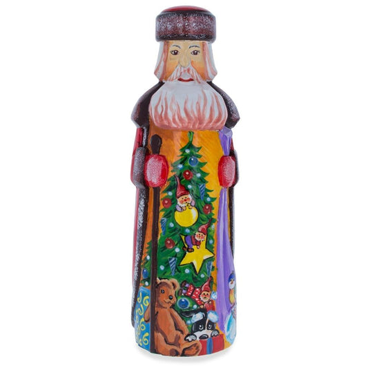 a painted wooden figurine of a santa claus