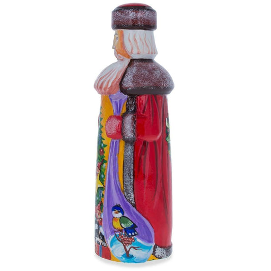 a painted figurine of a santa claus