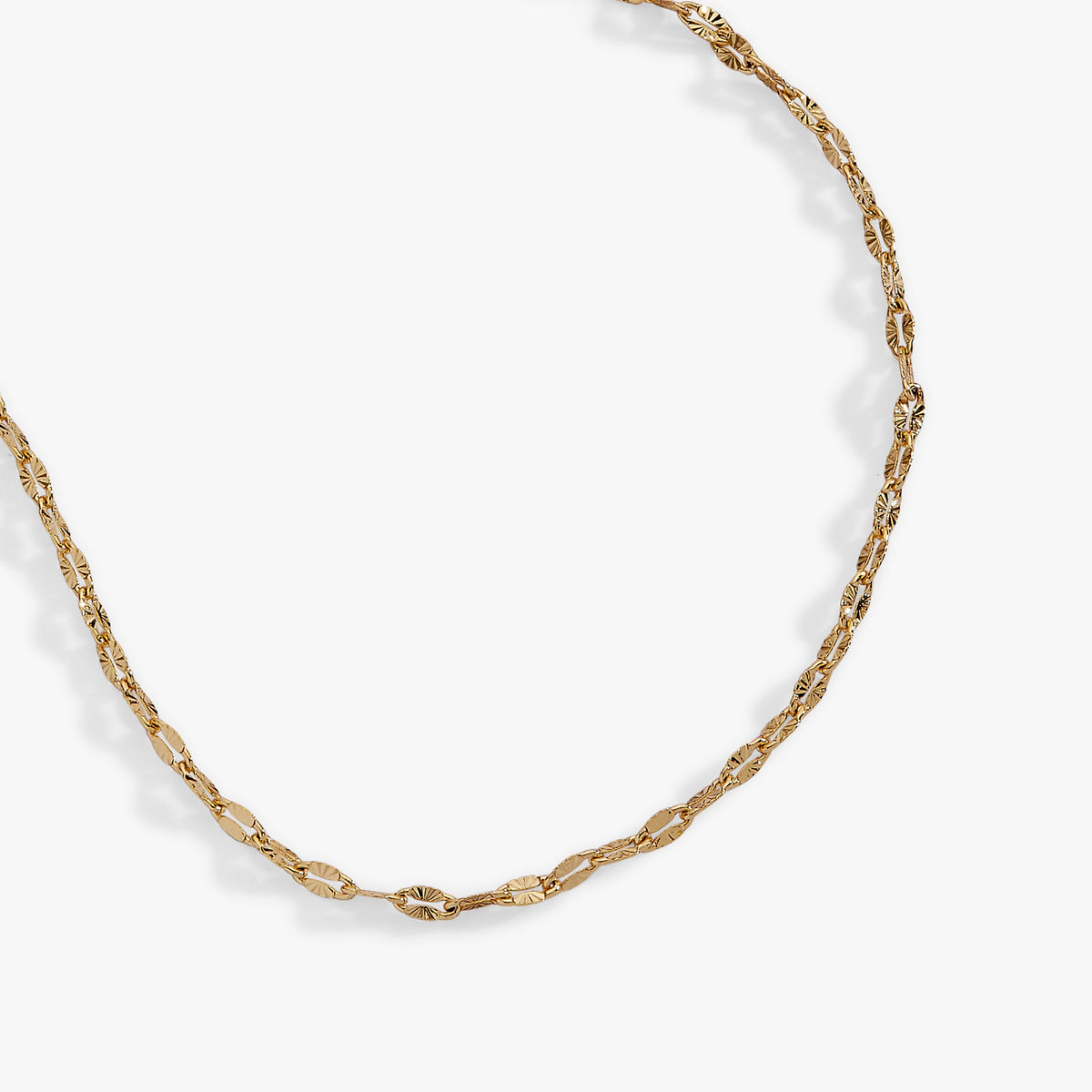 a gold chain on a white background