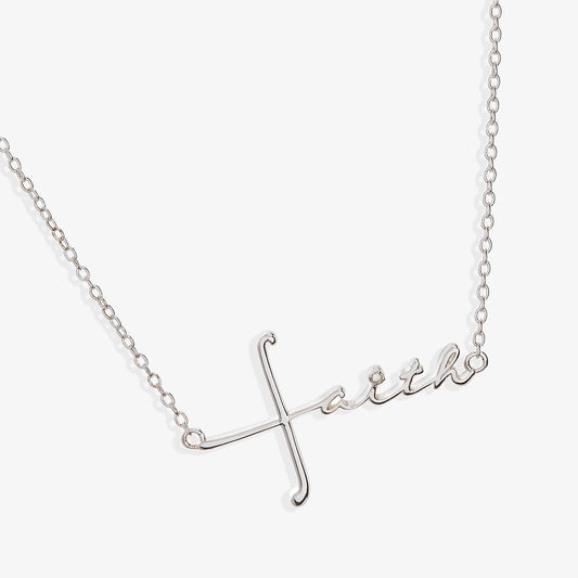 a silver necklace with a word on it