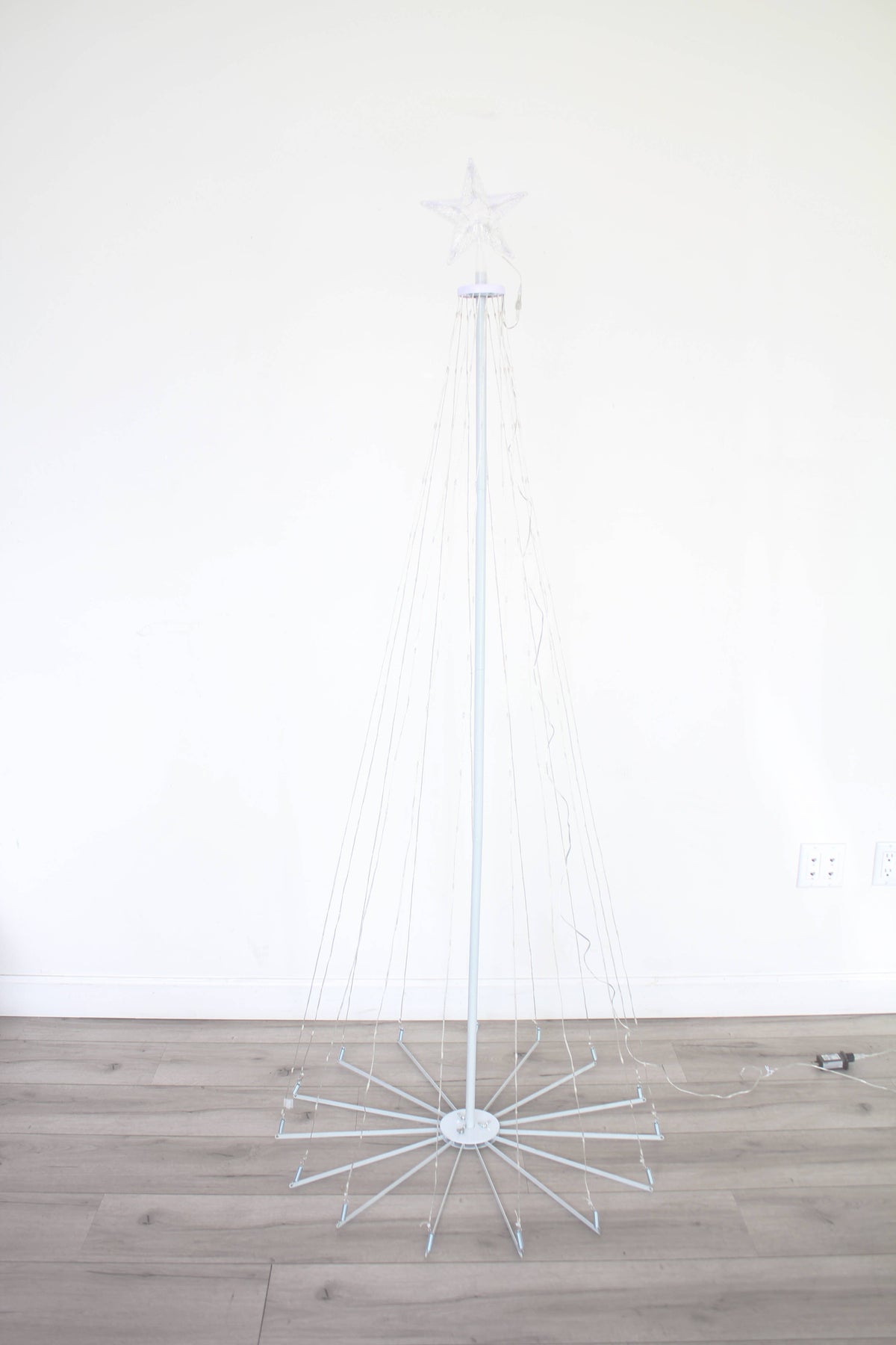 a white pole with a white object on it