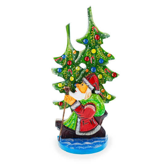 a statue of a santa claus holding a staff
