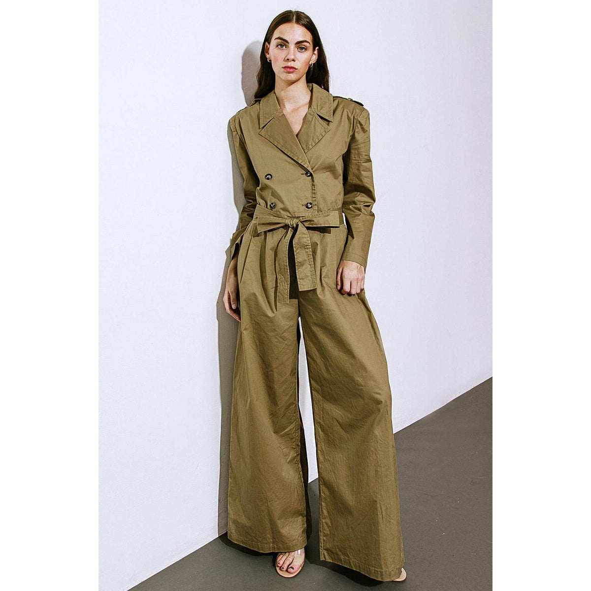a woman in a green jumpsuit