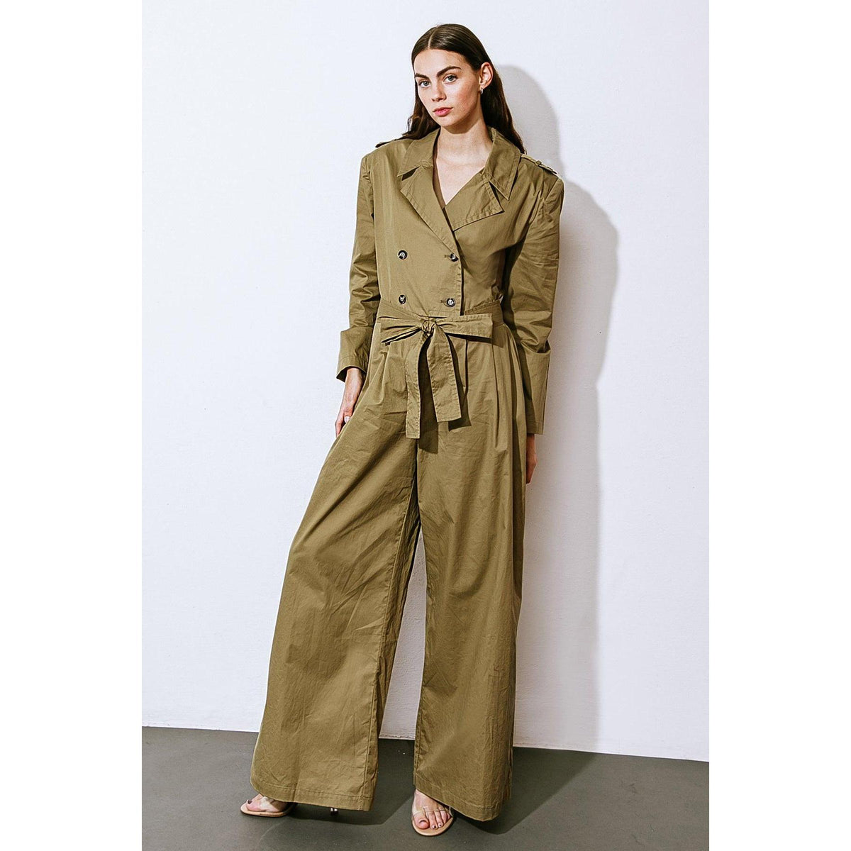 a woman in a green suit