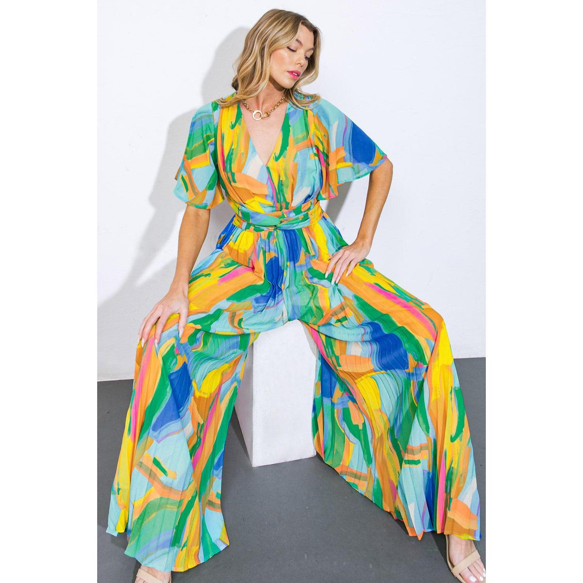 a woman in a colorful jumpsuit