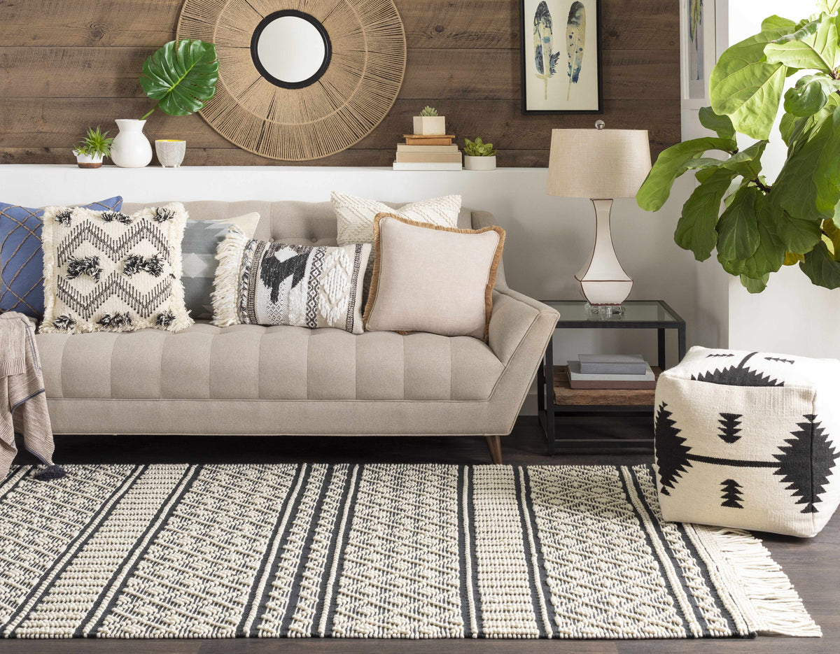 a couch with pillows in a room