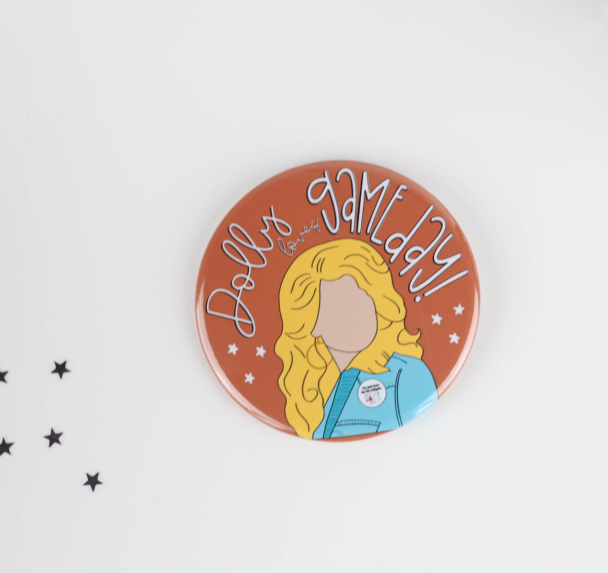 a button with a drawing of a woman