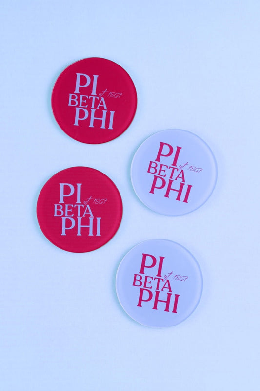 a group of round red and white badges