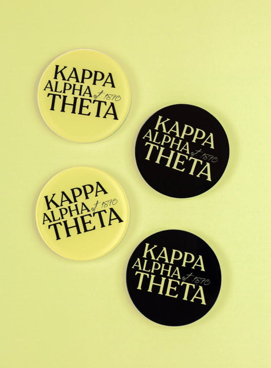 a group of black and yellow round badges