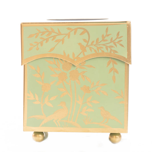 a green box with gold designs
