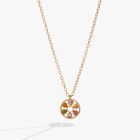 a gold necklace with a pendant