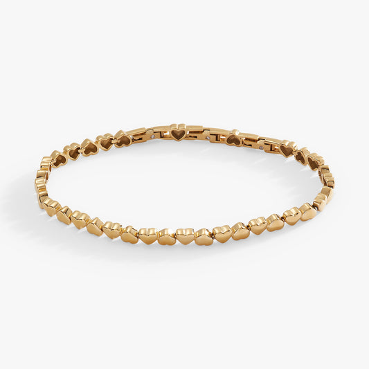 a gold bracelet with hearts on it