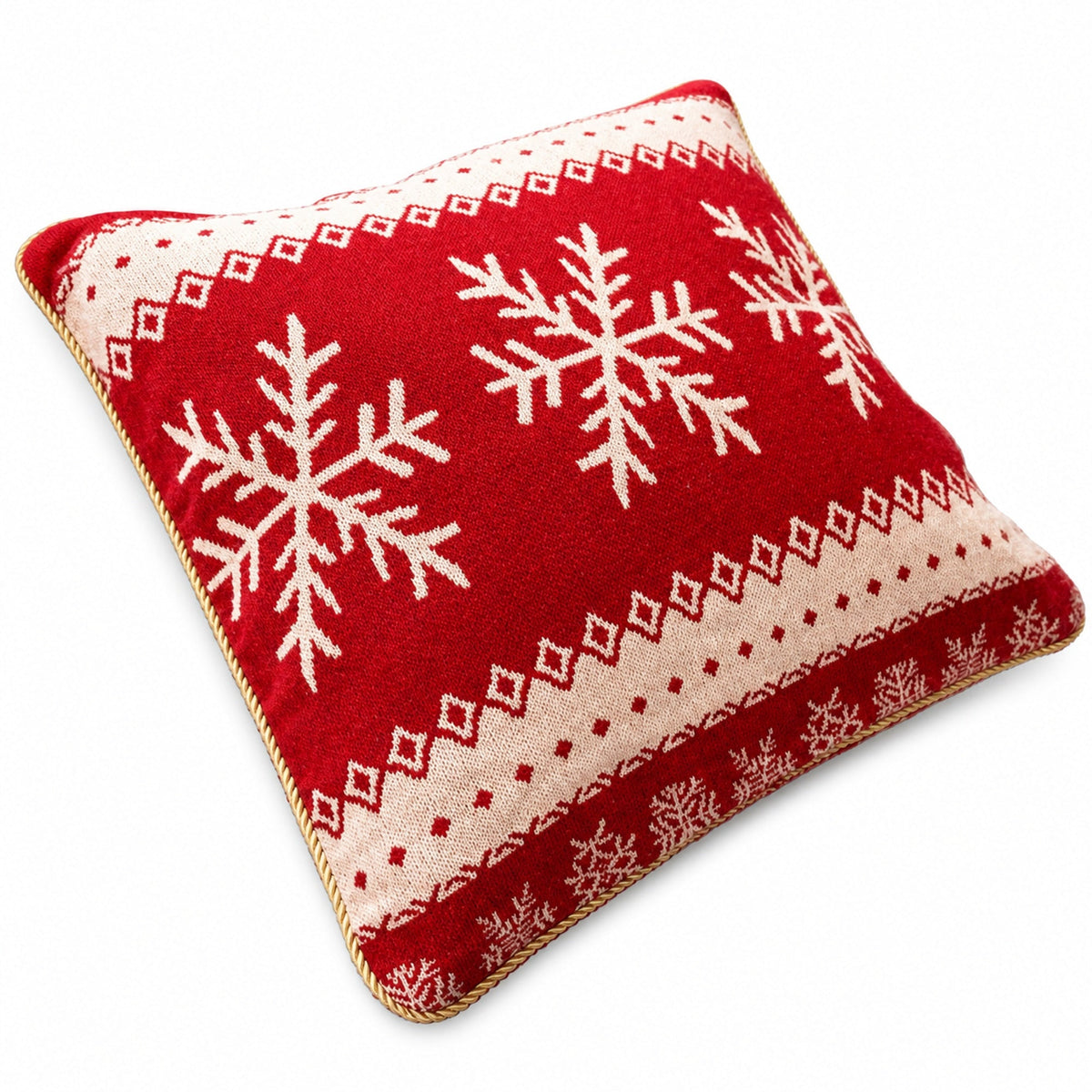 a red and white pillow with snowflakes