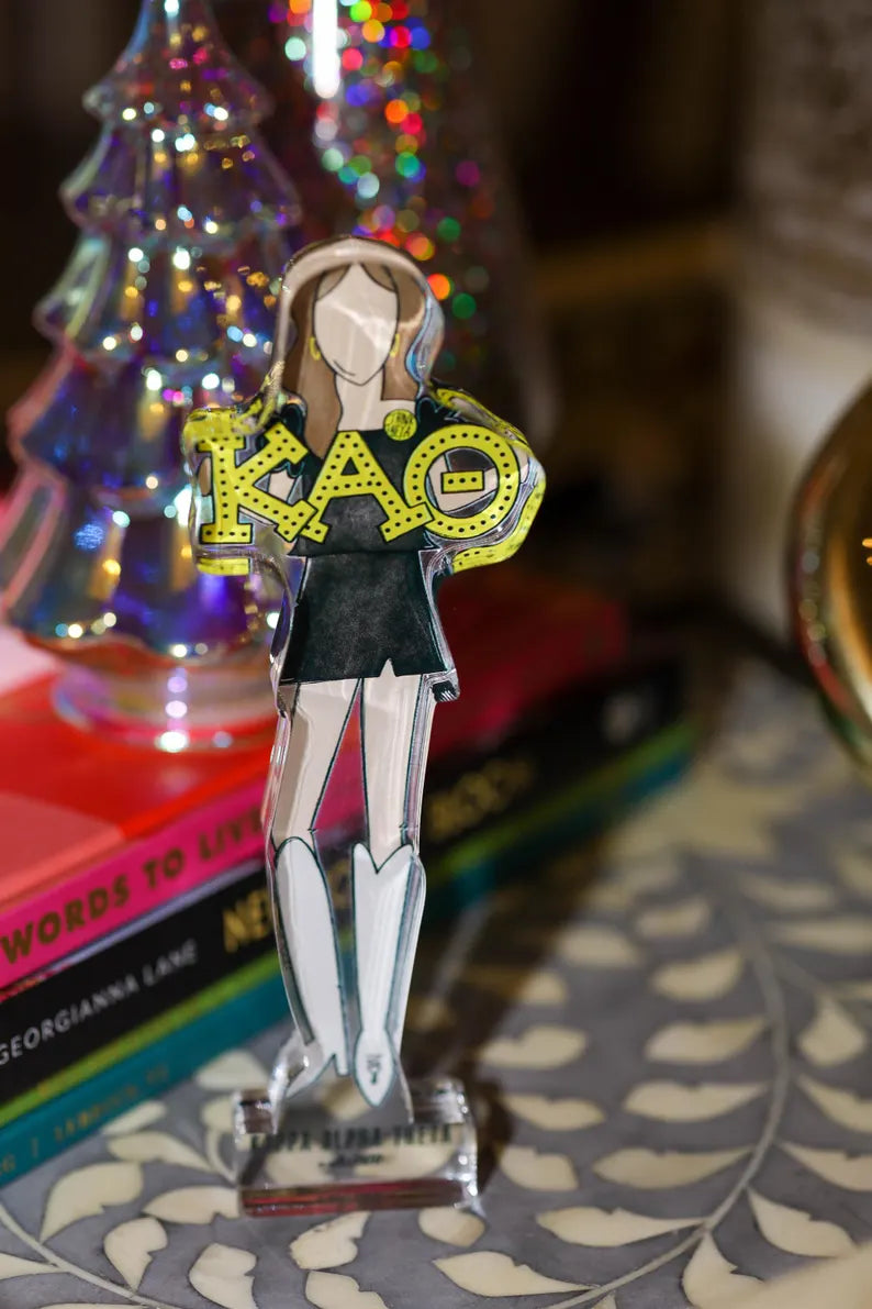 a paper doll on a table