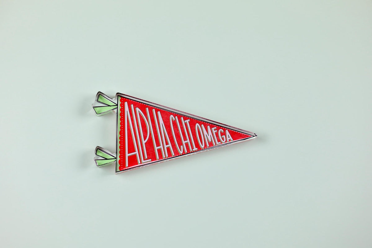a red triangle shaped object with white text