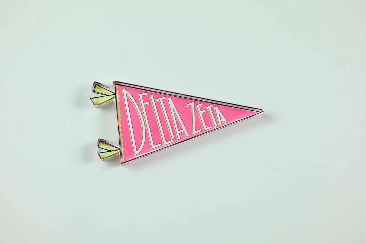 a pink triangular object with white text