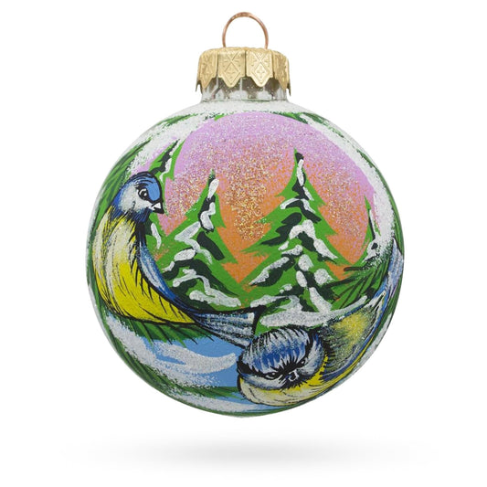 a christmas ornament with a painting on it