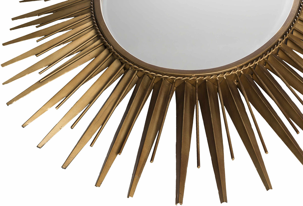 a mirror with a gold frame