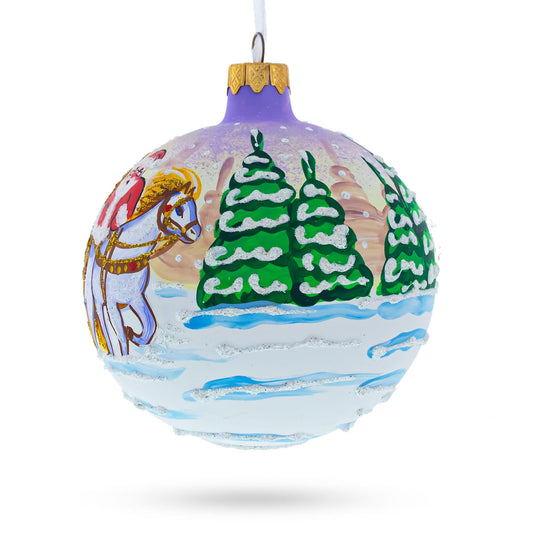 a christmas ornament with a horse and trees painted on it