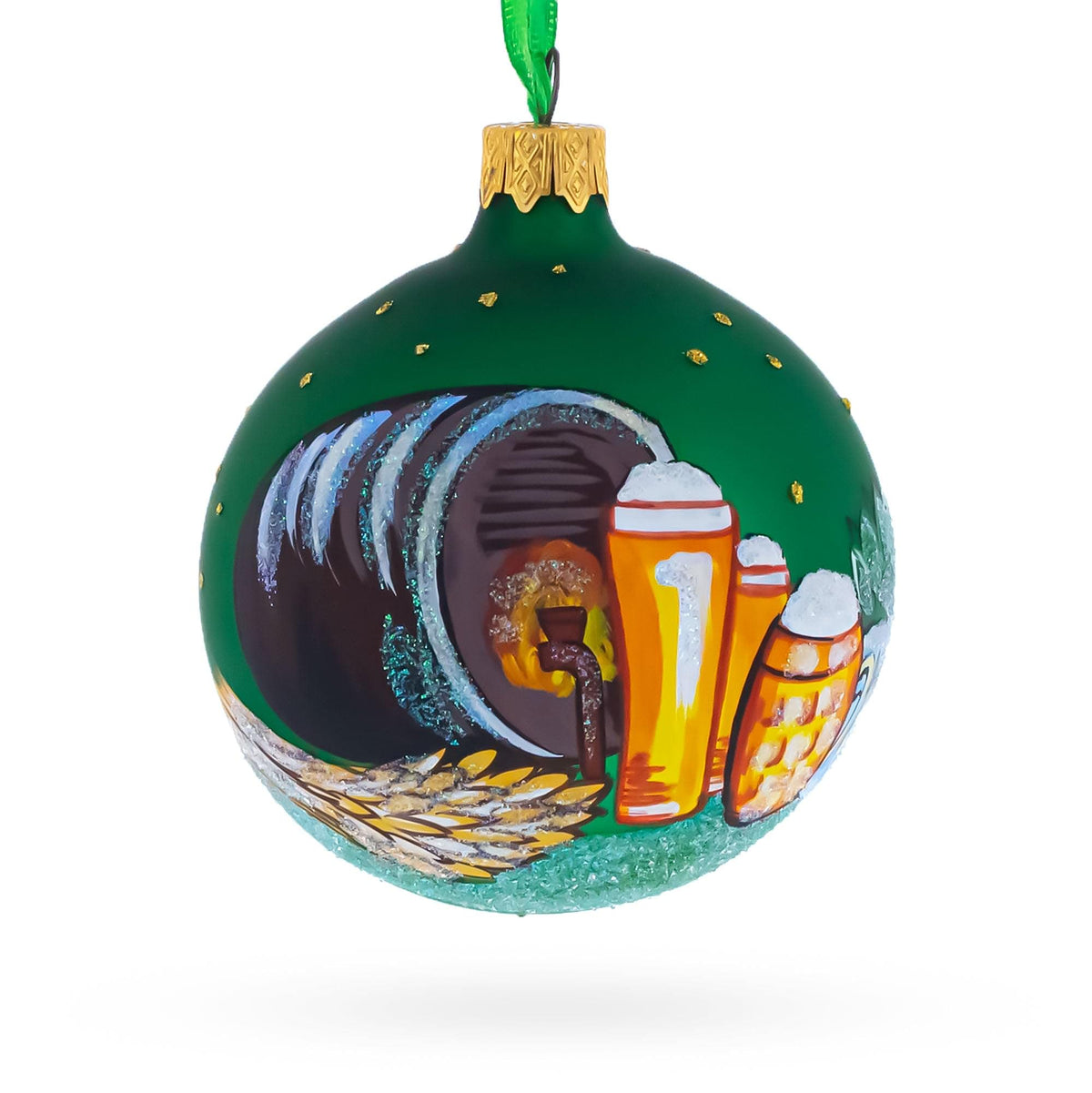 a green christmas ornament with a painted design